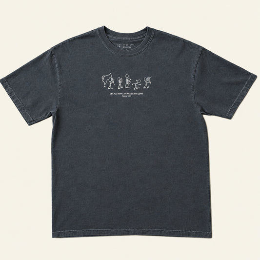 A dark charcoal gray short-sleeve t-shirt with a small white graphic print on the chest, laid flat on an ivory background.